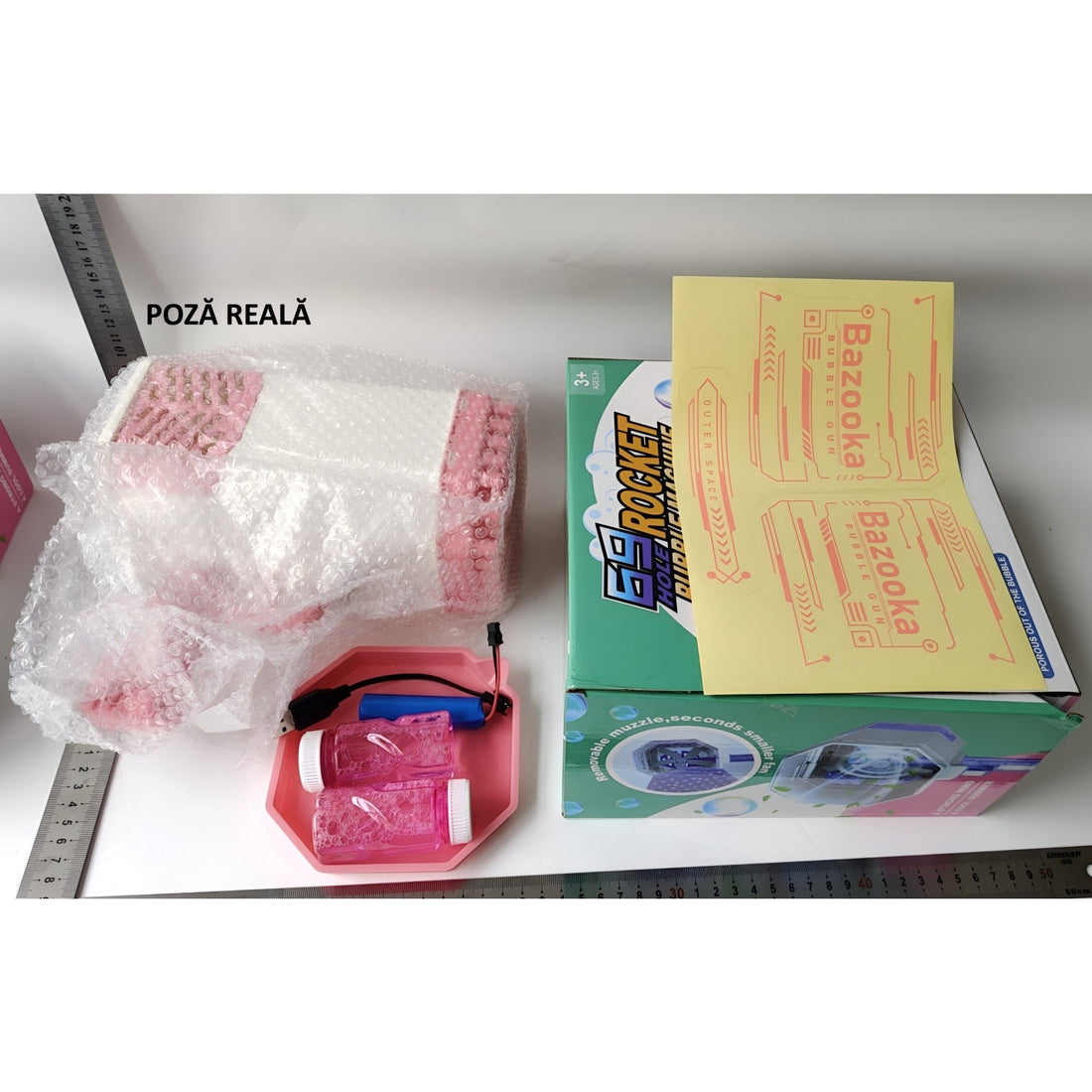 Pistol de bule de săpun cu 69 găuri și lumini colorate – 24 cm, roz